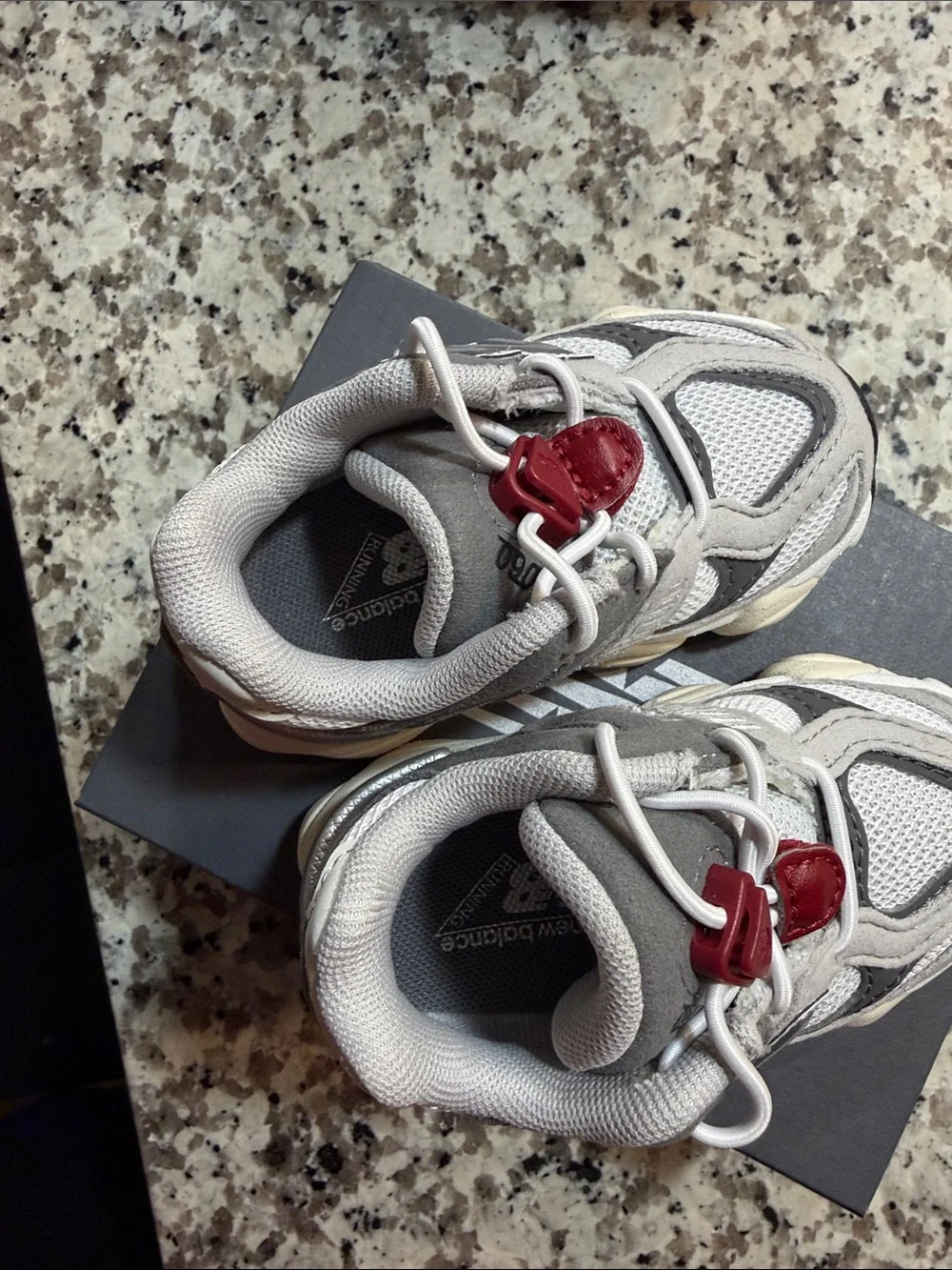 New Balance Kids Gray Sneakers with Red Toggle